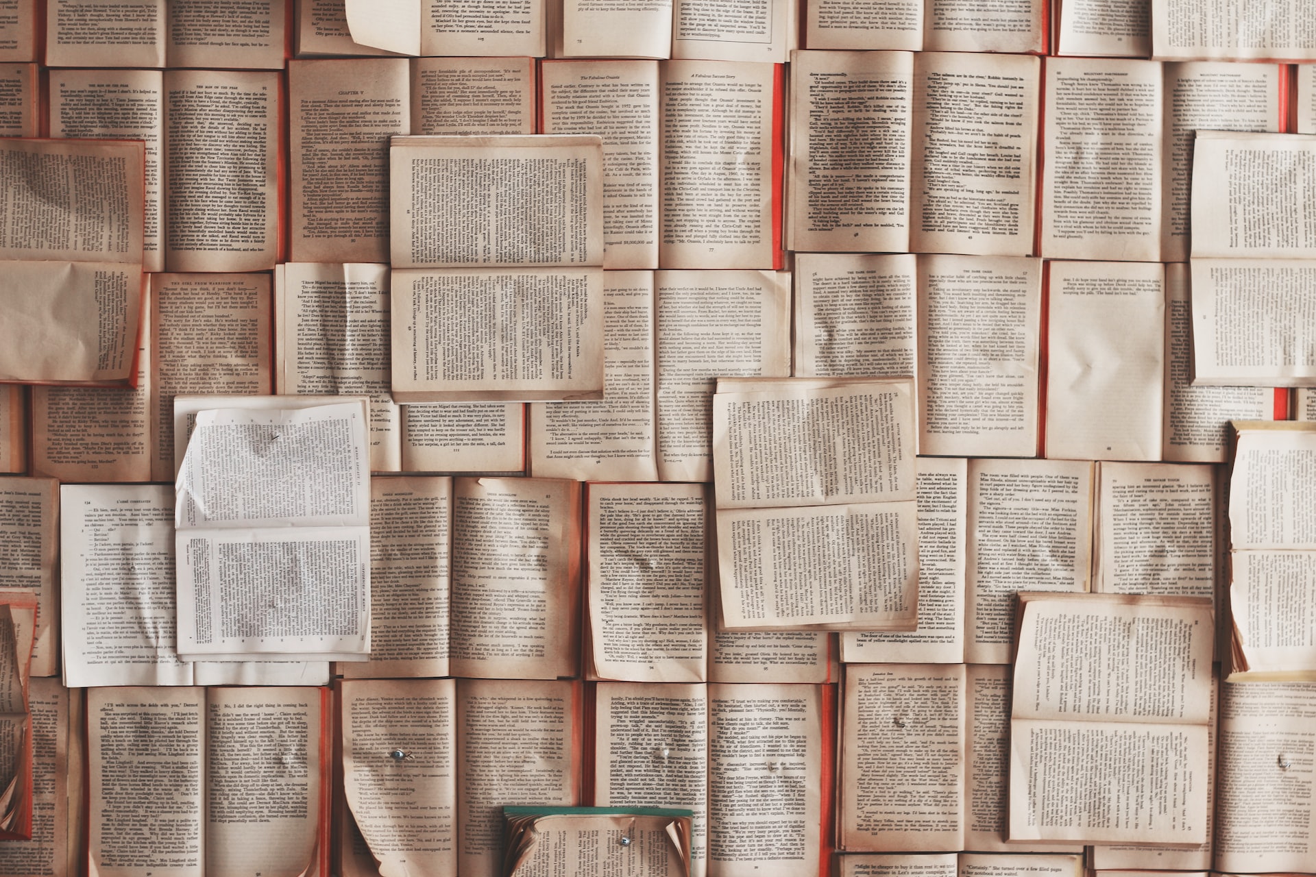 Books are piled upon other books